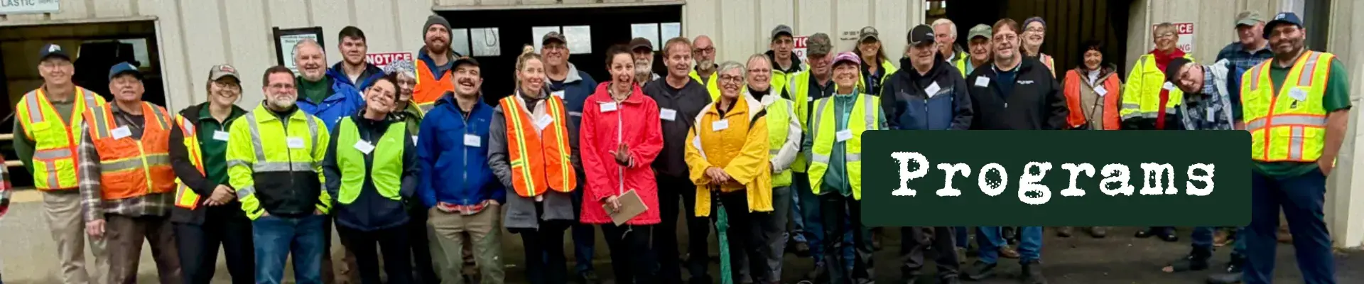 Row of smiling operators with the word "programs" in text overlay