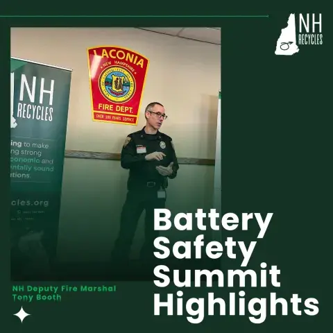 Man talking standing under a fire department banner