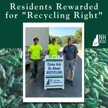 three transfer station operators with an "ask us about recycling" sign