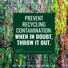 Text:  Prevent recycling contamination.  When in doubt, throw it out.  Photo:  Bales of recyclables.  
