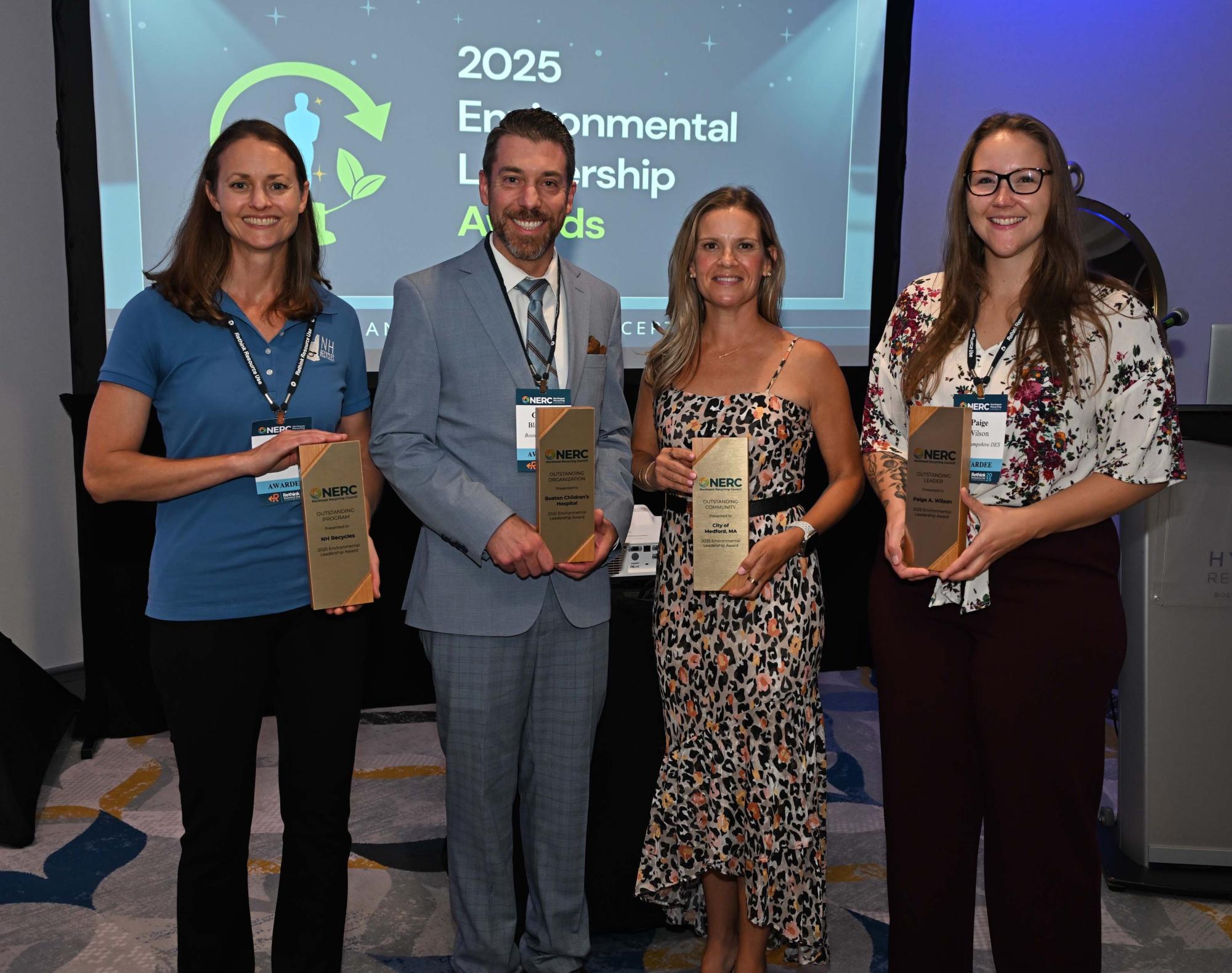 Four smiling NERC award winners