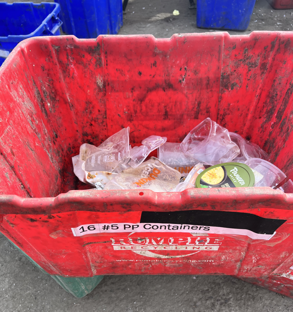 close up of red container with empty fast food cups