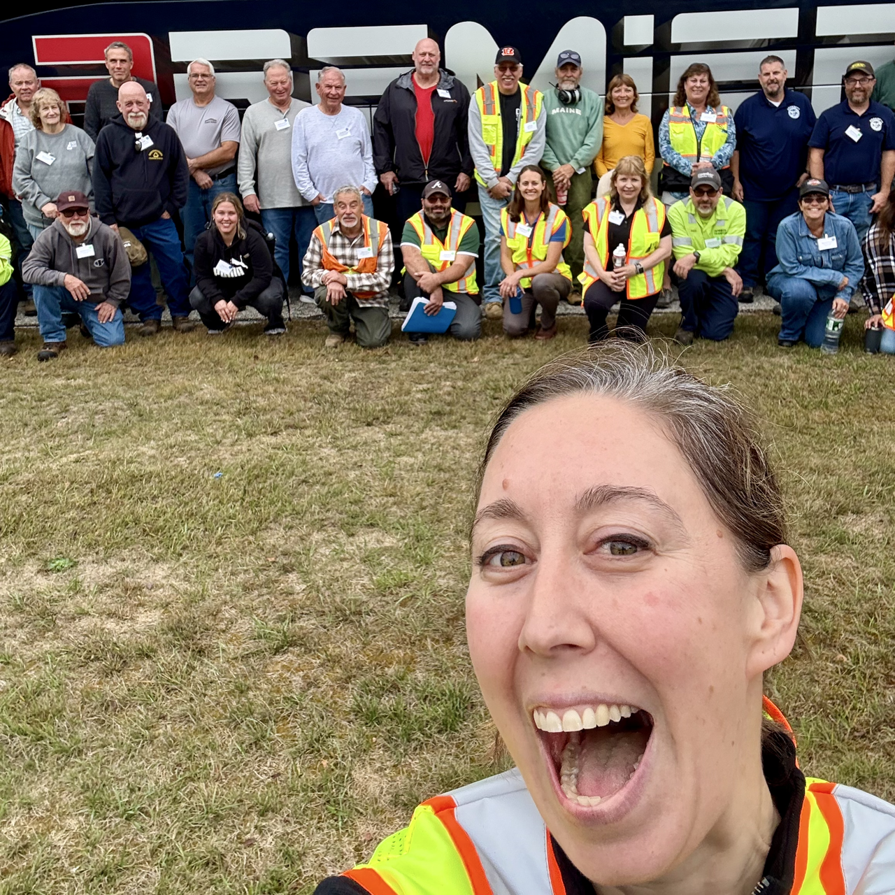 Woman smiling with operators in the background