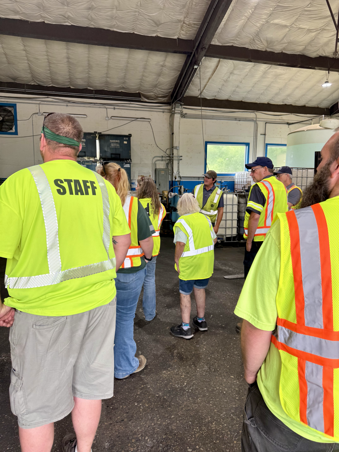 group of people looking at turnings and coolant