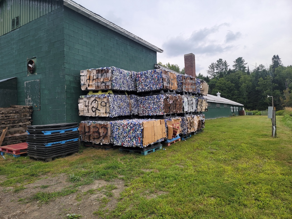 baled aluminum cans outside green building
