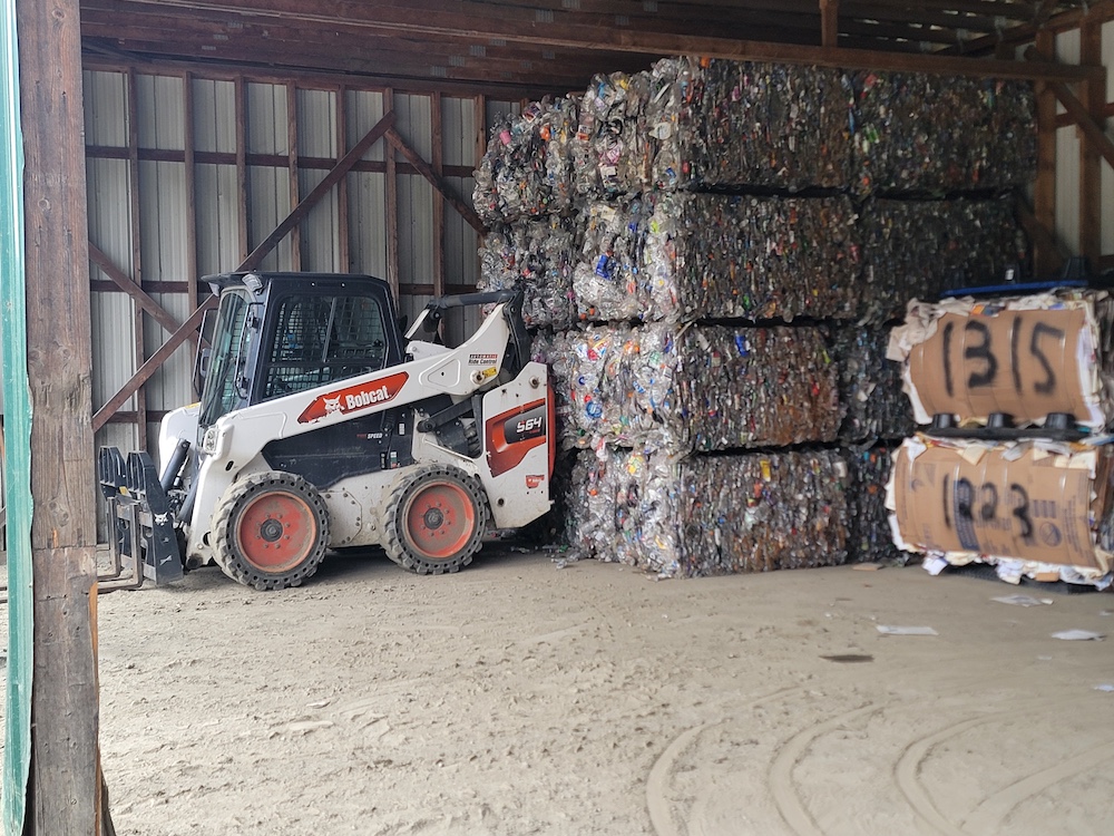 skid steer coos county recycling center