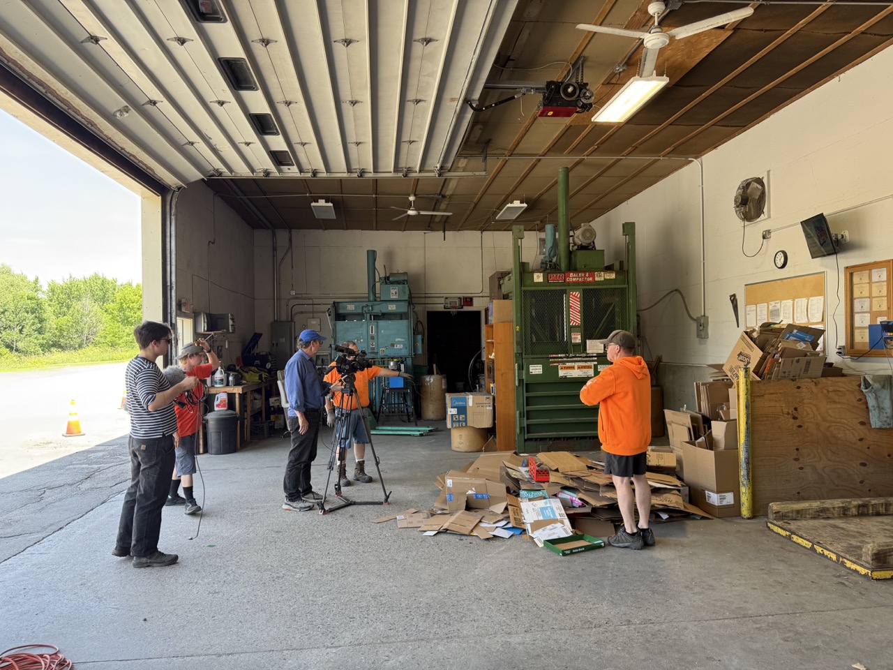 filming a cardboard bale being loaded