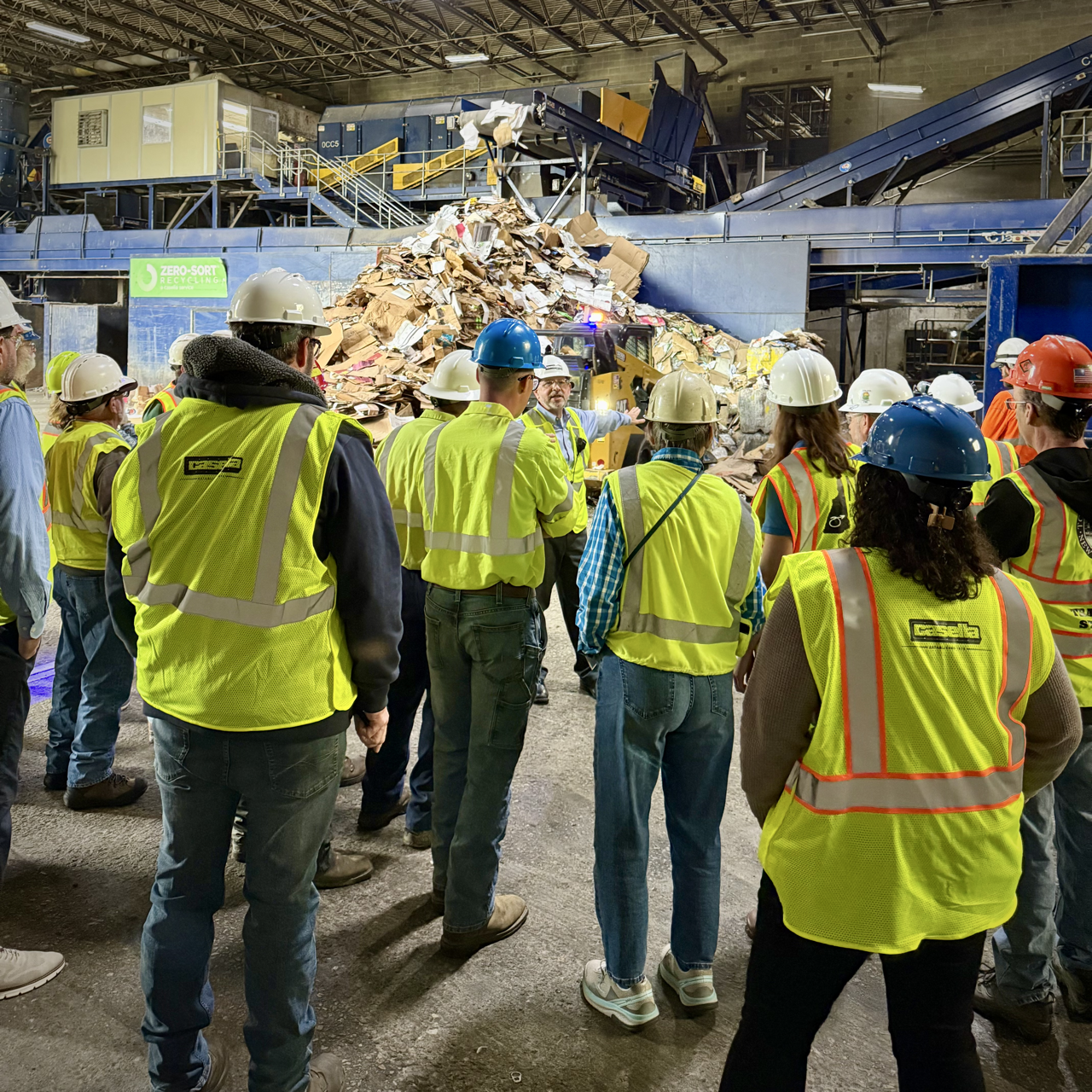 group looking at cardboard recycling