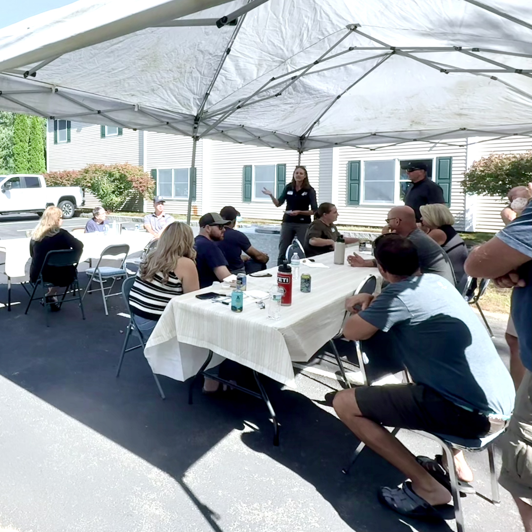 Reagan speaking to group at Paula's 35 anniversary celebration