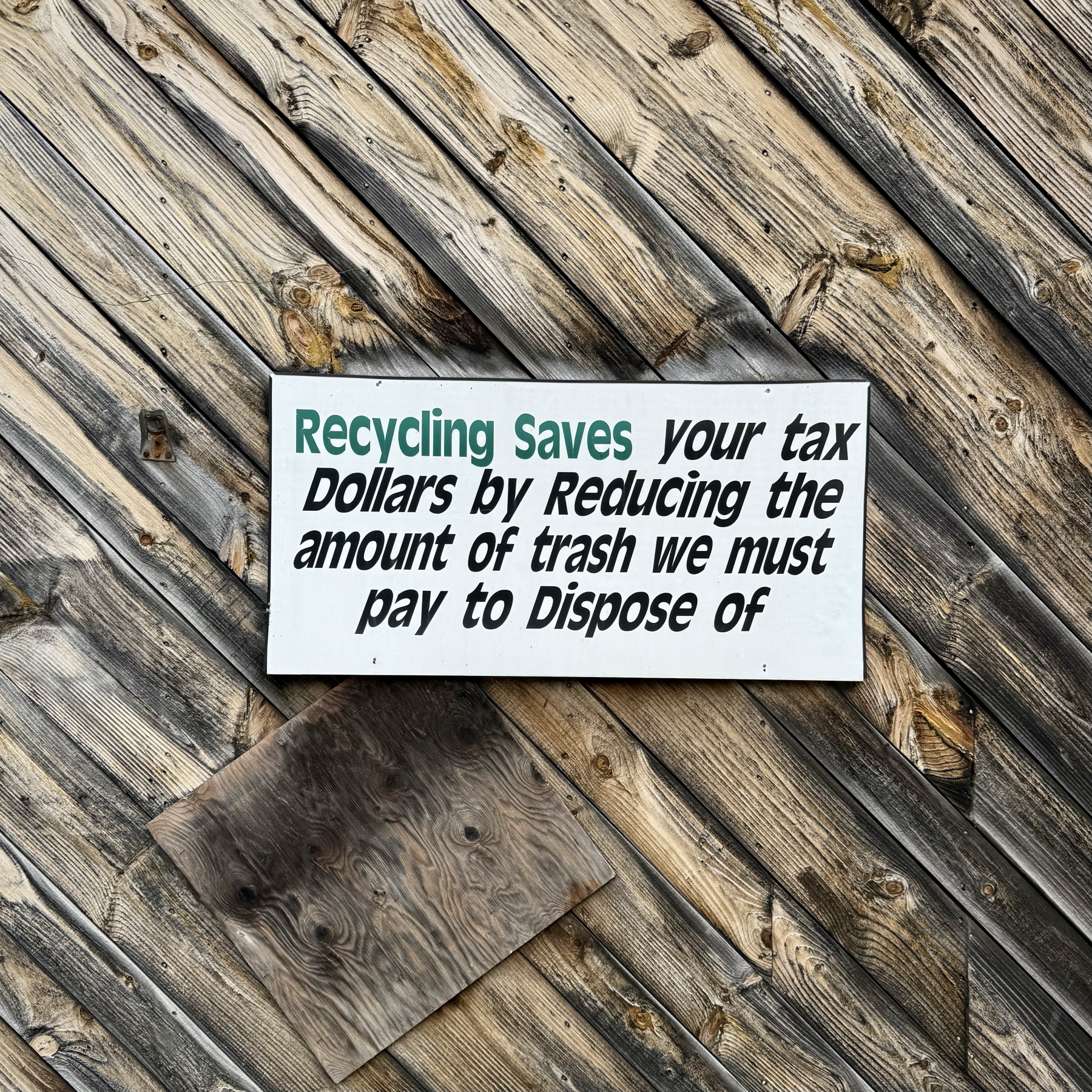recycling saves tax dollars sign