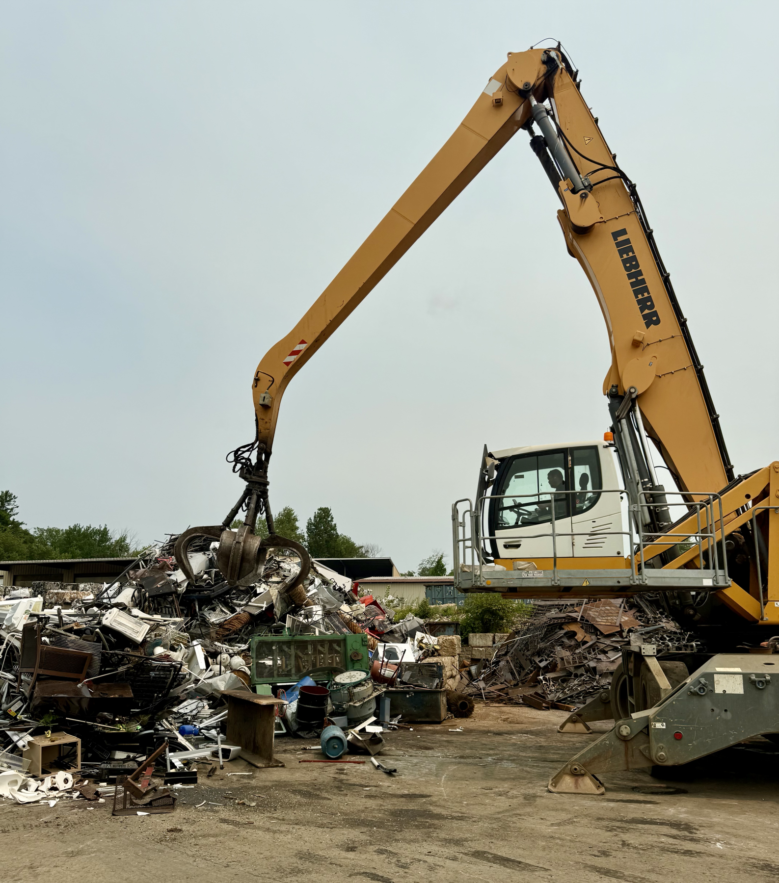 large crane moving scrap metal