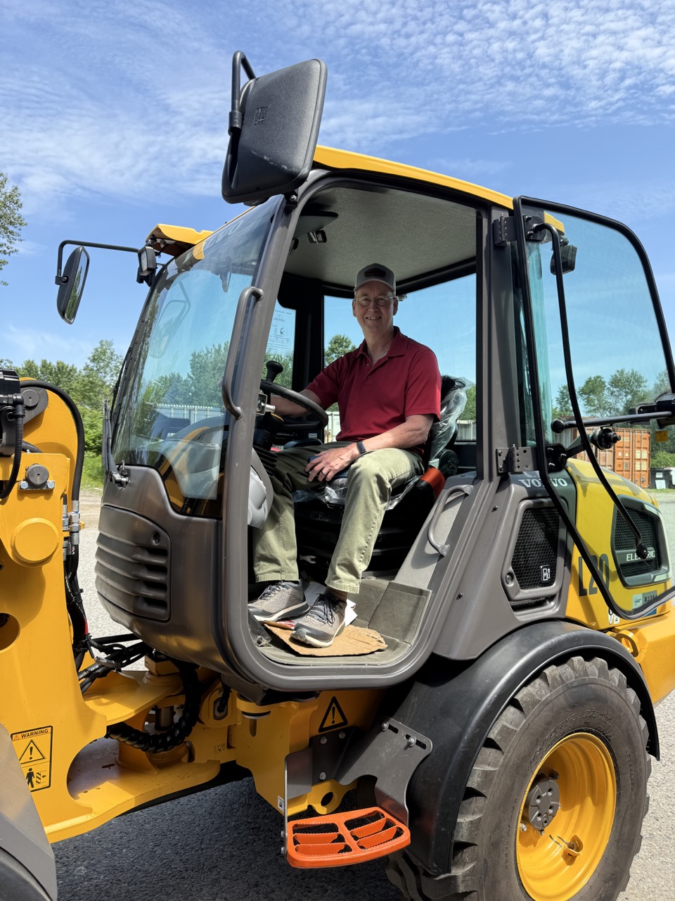 Steve in an electric loader