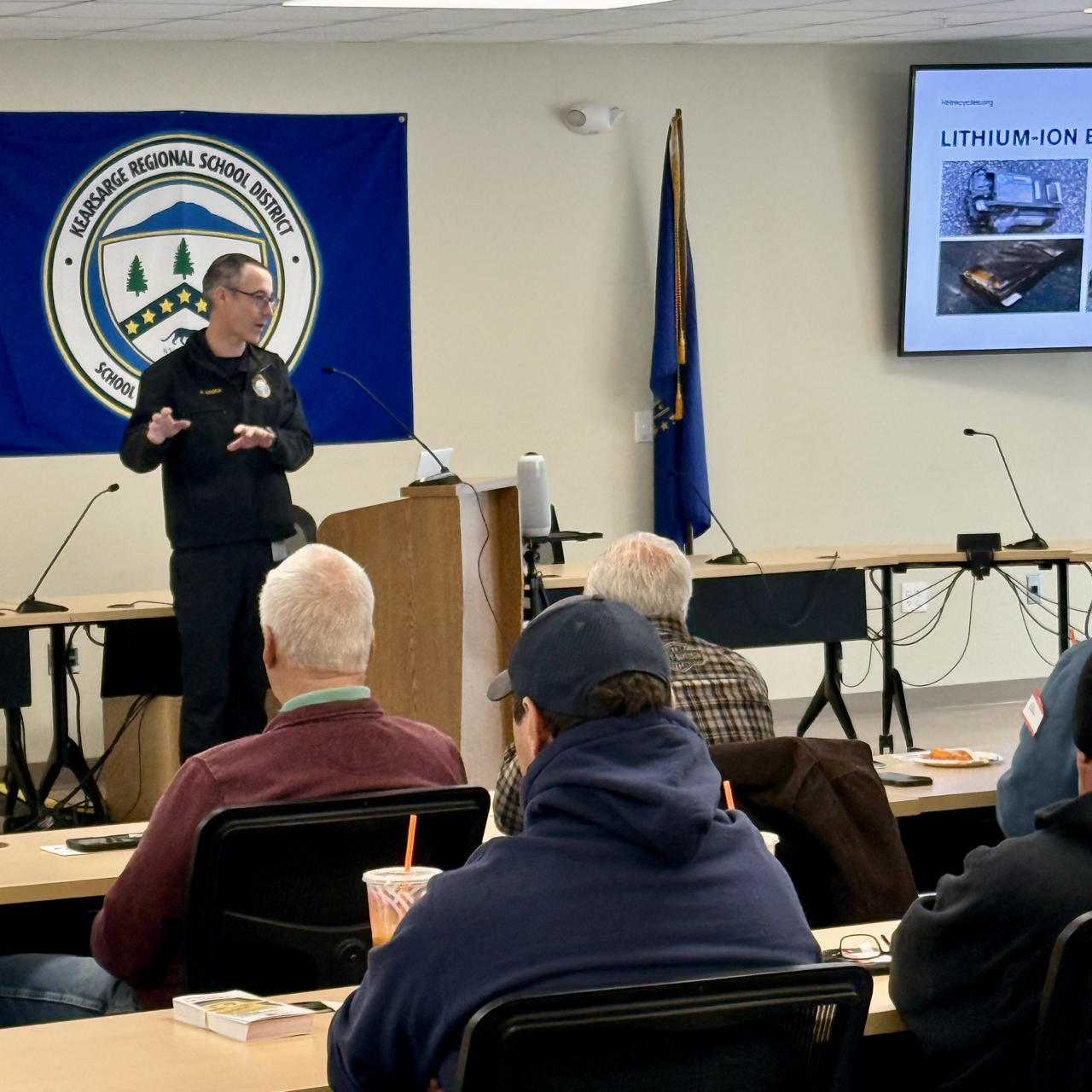 Deputy Fire Marshal Tony Booth explaining Lithium-Ion battery safety in a classroom