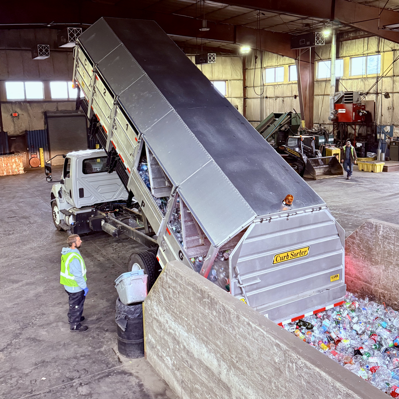 source separated truck dumping recyclables