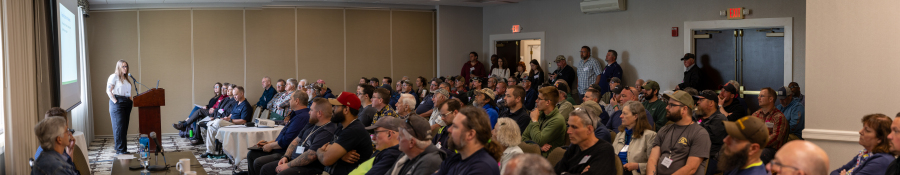 Paige Wilson speaking to full workshop about battery disposal ban