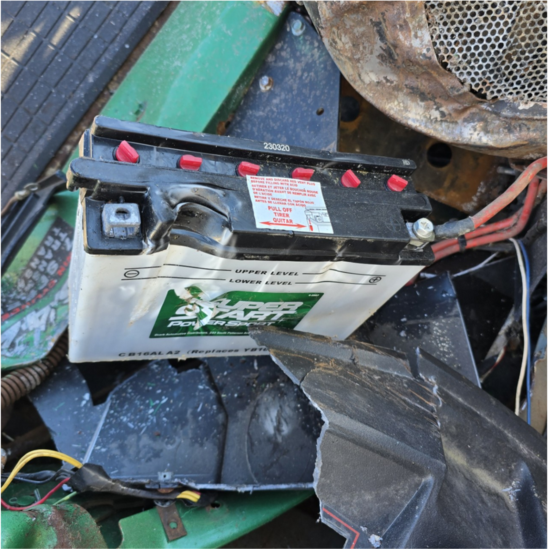 lead acid battery in scrap metal pile